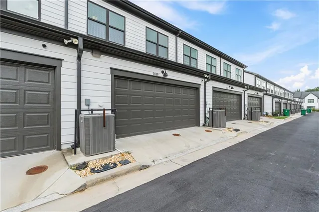 a view of a street with a building in the background