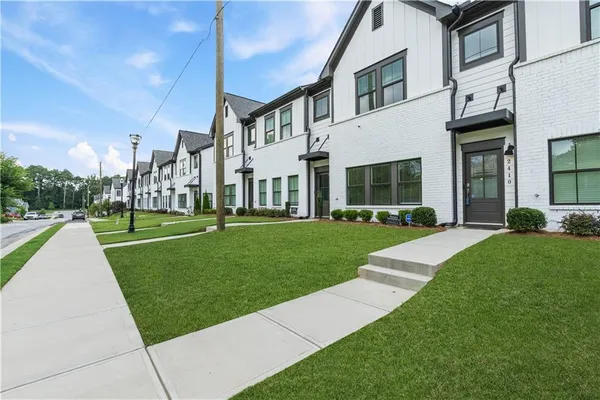 a view of a building with a yard