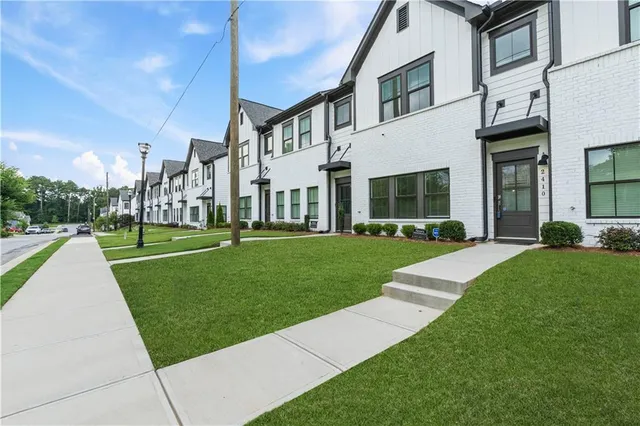 a view of a building with a yard