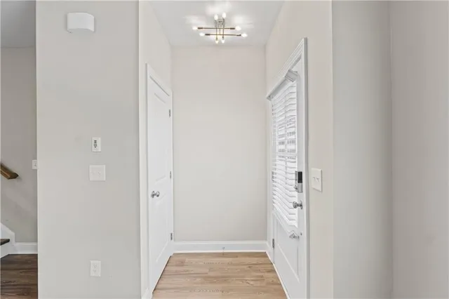 a view of an entryway with chandelier
