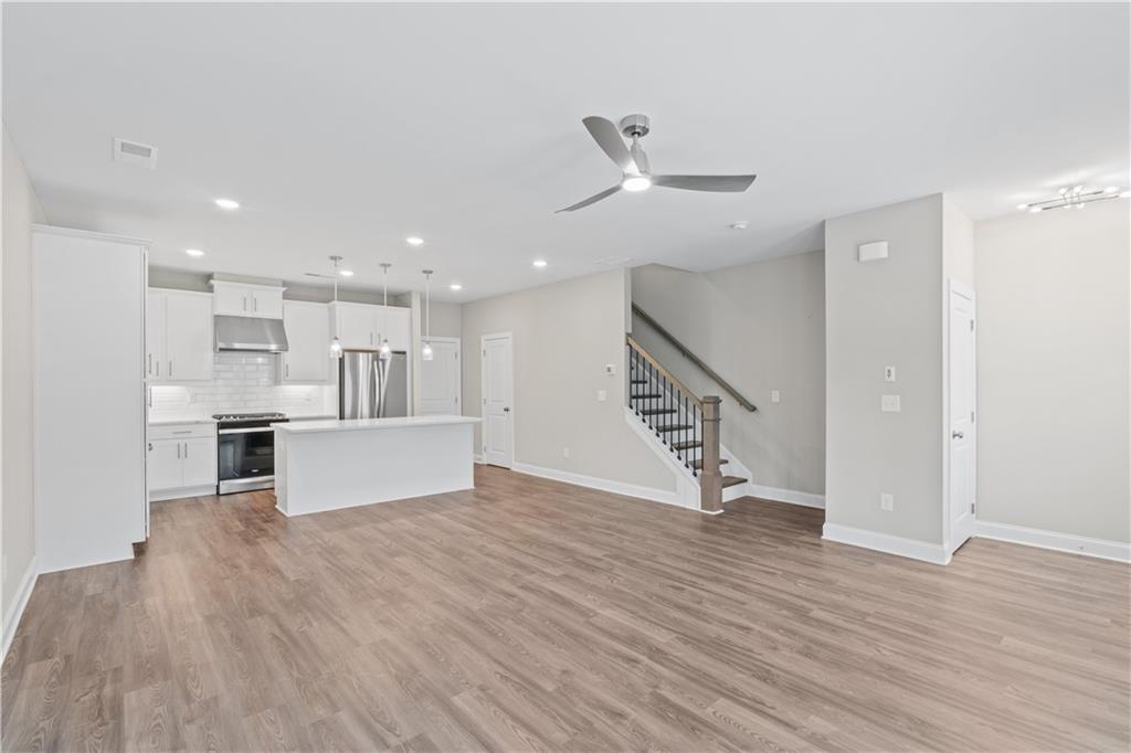 2410 Lakeshore Lane Atlanta, GA 30316 - Photo 6 of 31 a view of a kitchen with wooden floor and a sink