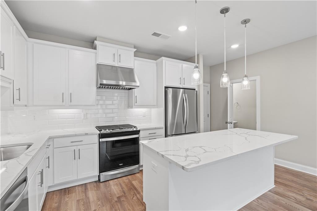 2410 Lakeshore Lane Atlanta, GA 30316 - Photo 8 of 31 a kitchen with a stove a refrigerator and a sink