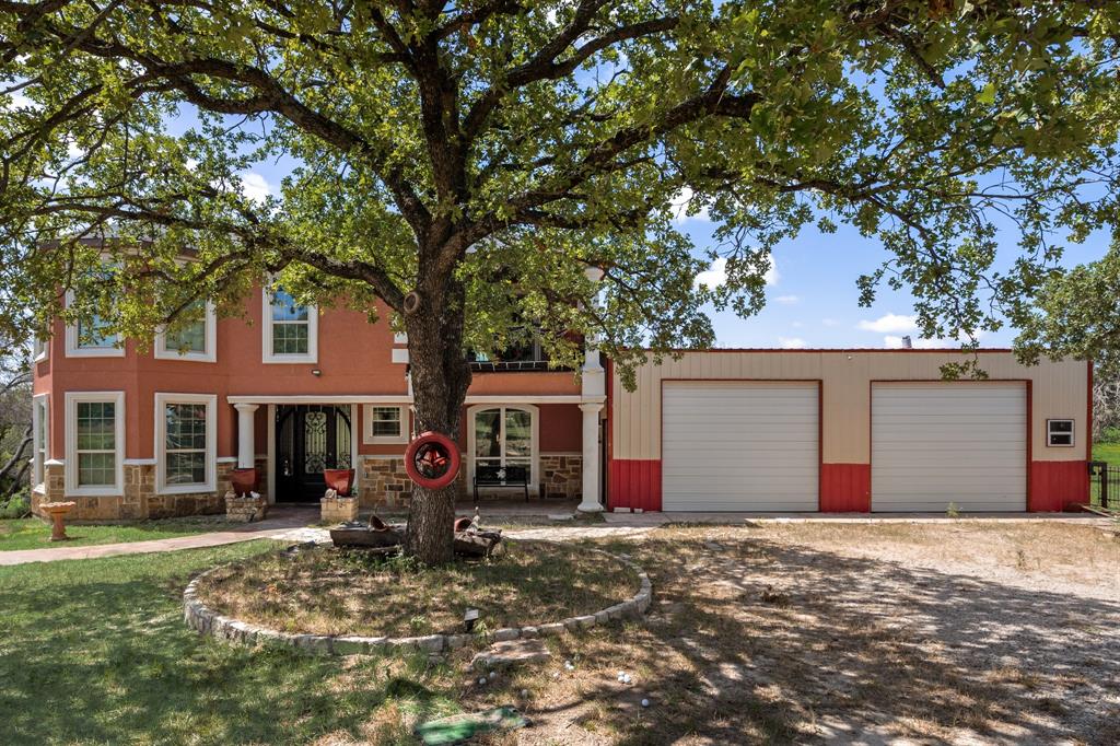 2277 County Road 3657 Springtown, TX 76082 - Photo 11 of 40 a view of a house with a yard