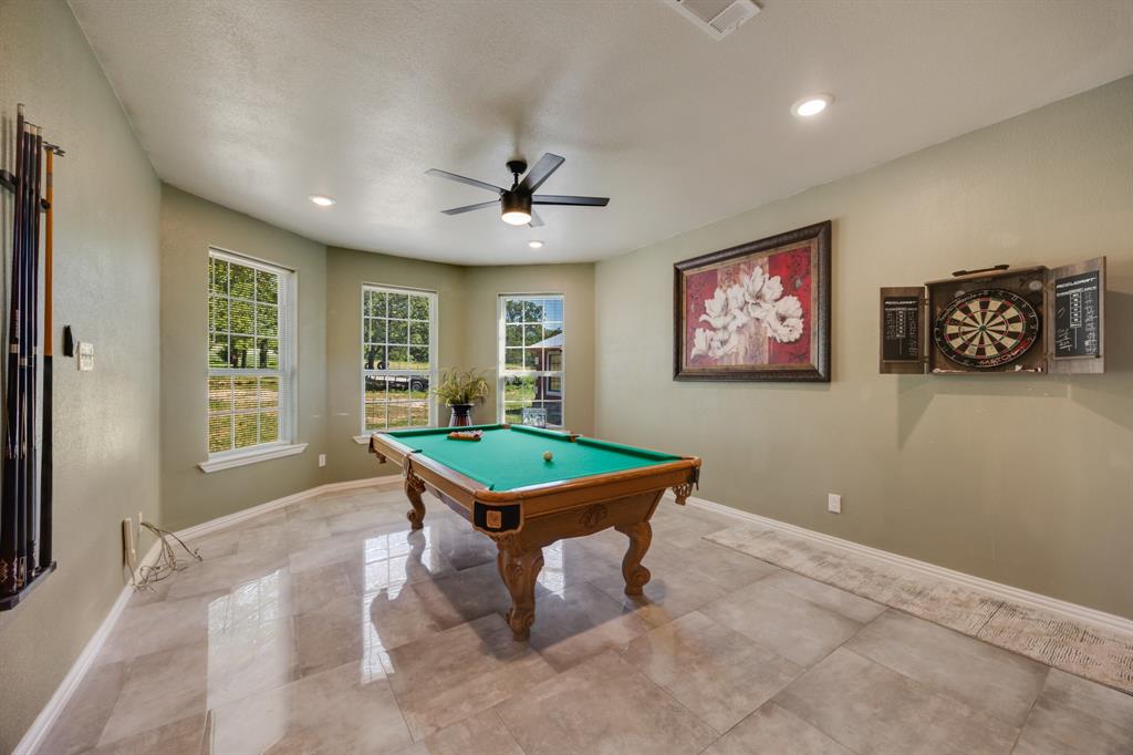 2277 County Road 3657 Springtown, TX 76082 - Photo 15 of 40 a room with furniture pool table and windows