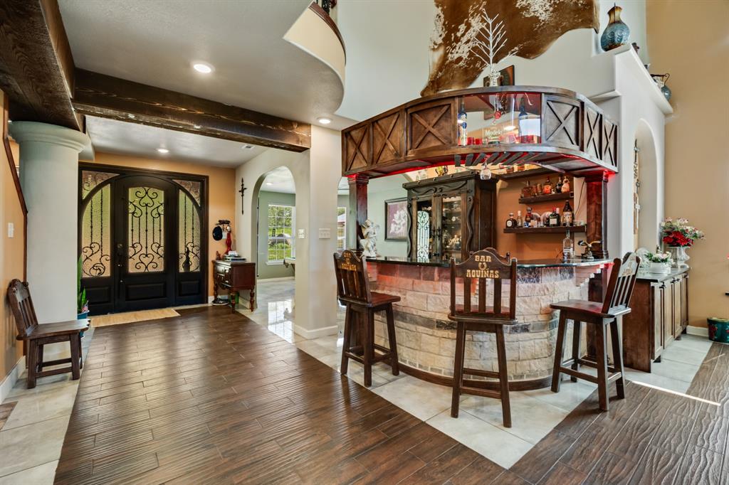 2277 County Road 3657 Springtown, TX 76082 - Photo 17 of 40 an entryway a livingroom with furniture and wooden floor