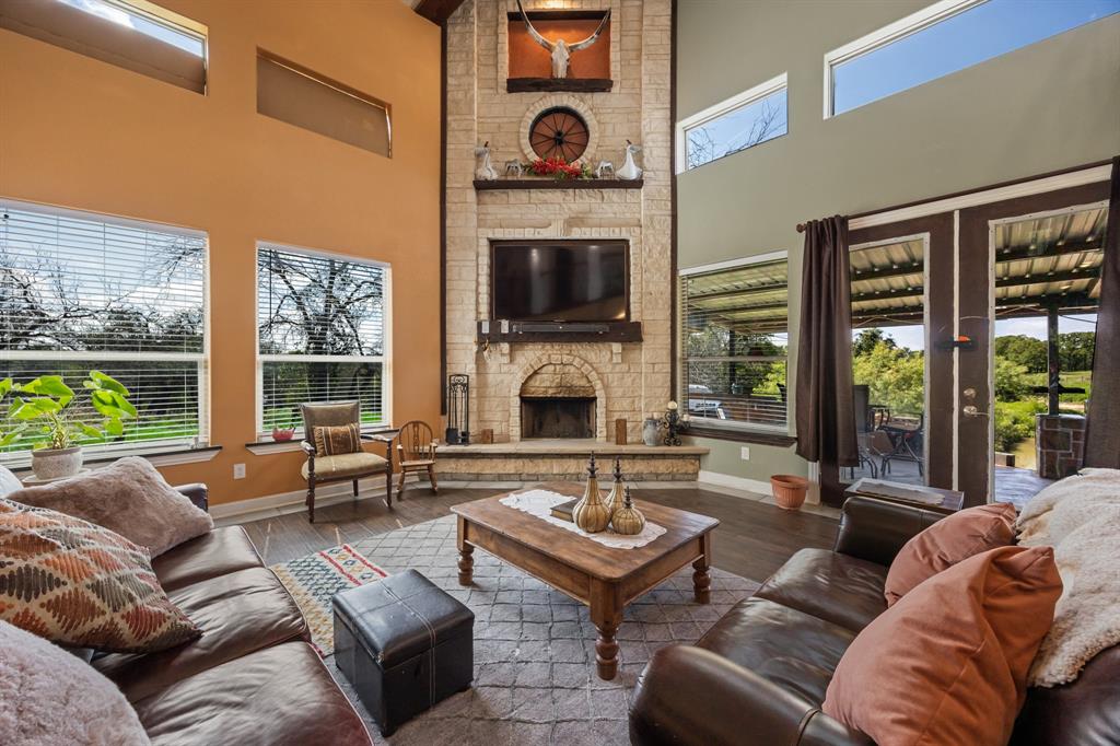 2277 County Road 3657 Springtown, TX 76082 - Photo 18 of 40 a living room with furniture fireplace and flat screen tv
