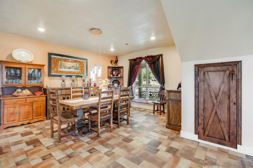 2277 County Road 3657 Springtown, TX 76082 - Photo 21 of 40 a view of a dining room with furniture