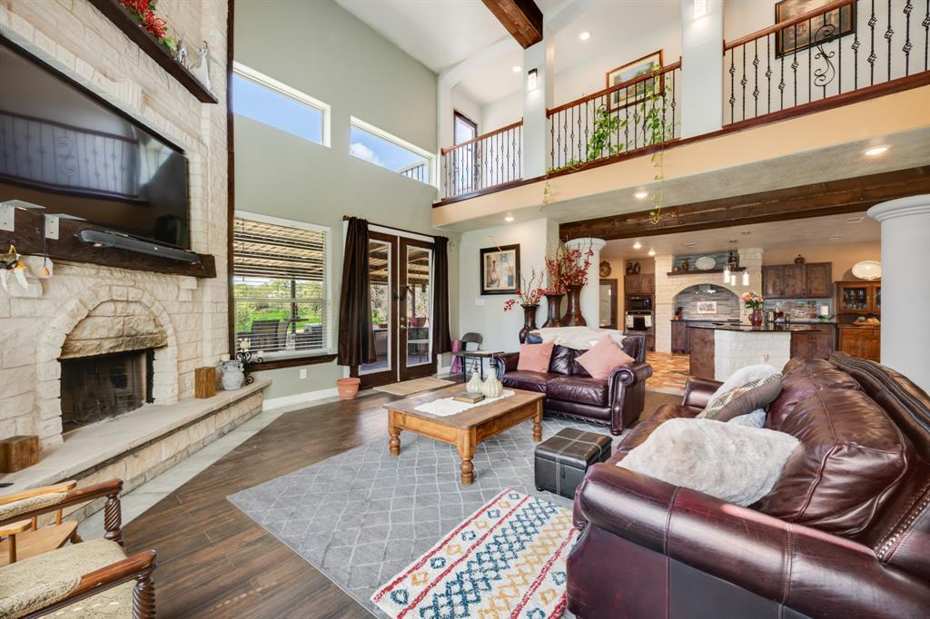 2277 County Road 3657 Springtown, TX 76082 - Photo 28 of 40 a living room with furniture fireplace and flat screen tv