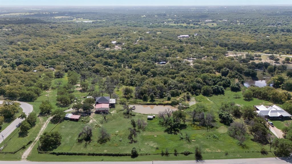 2277 County Road 3657 Springtown, TX 76082 - Photo 3 of 40 an aerial view of town with residential houses and covered with trees