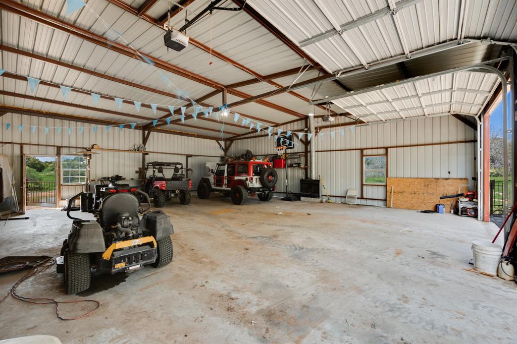 2277 County Road 3657 Springtown, TX 76082 - Photo 38 of 40 a view of a garage room with gym equipment