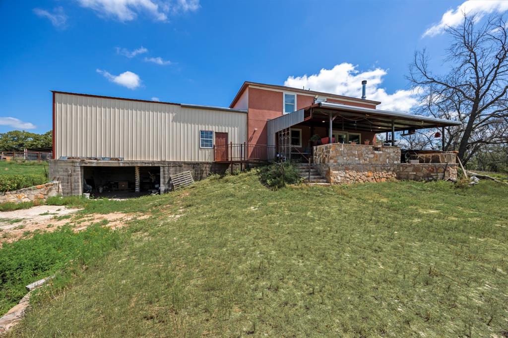 2277 County Road 3657 Springtown, TX 76082 - Photo 40 of 40 a view of a house with a backyard