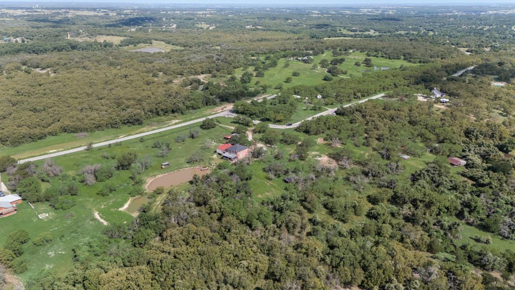 2277 County Road 3657 Springtown, TX 76082 - Photo 5 of 40 a view of a city with lush green forest