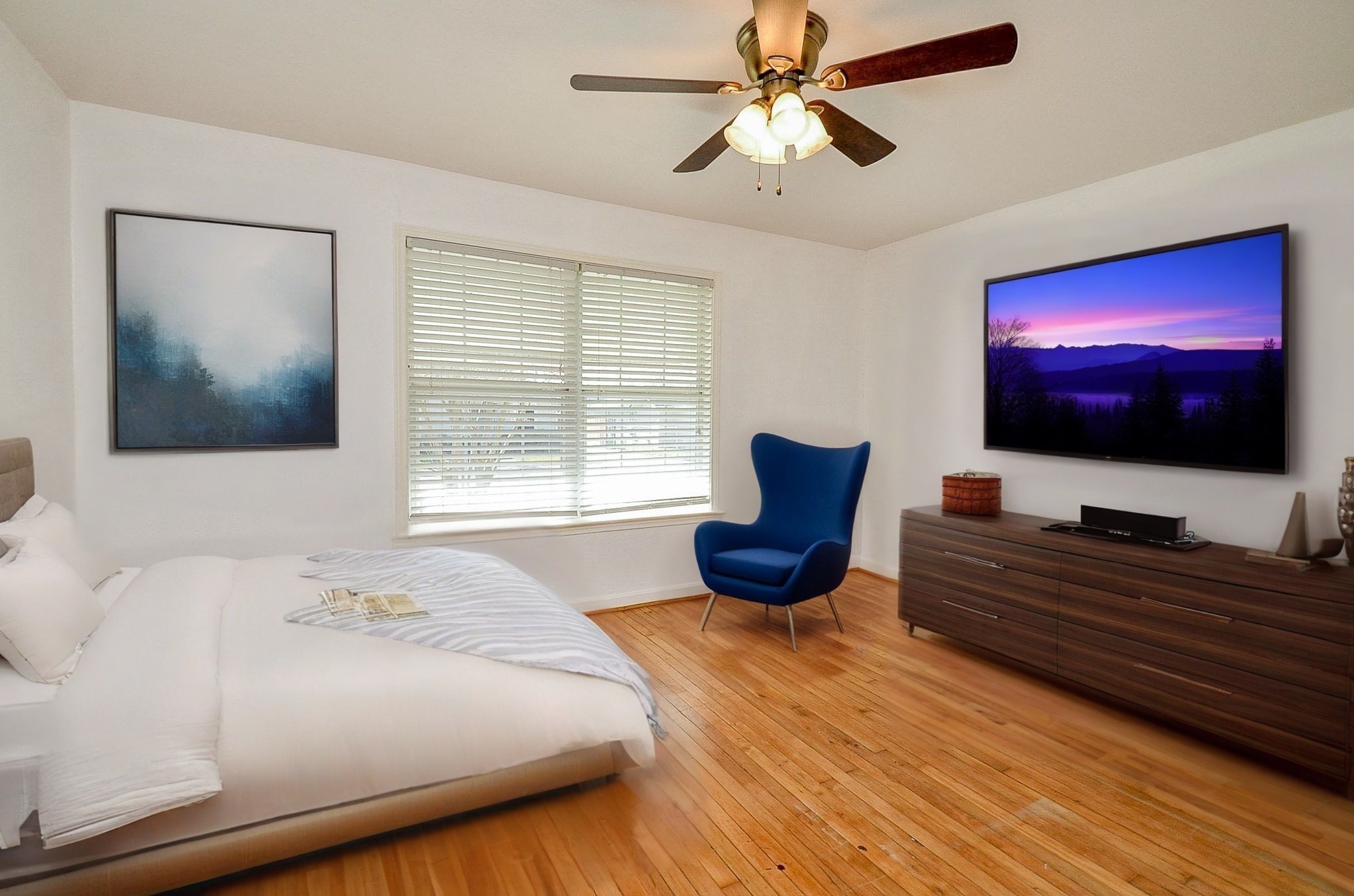 7707 Scanlock Street Houston, TX 77012 - Photo 2 of 19 a bedroom with a bed and a flat screen tv