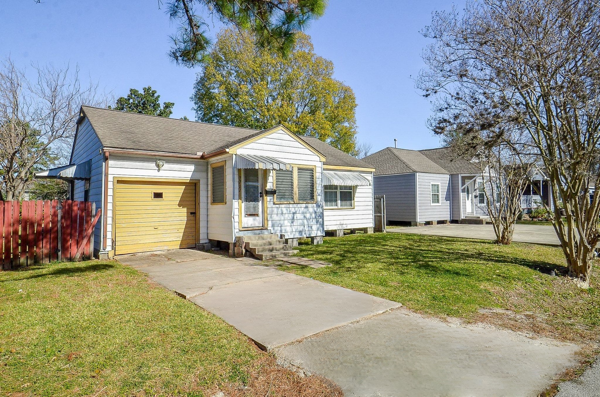 7707 Scanlock Street Houston, TX 77012 - Photo 7 of 19 a front view of a house with a garden