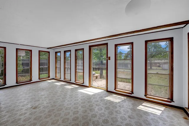 an empty room with windows