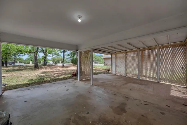 a view of an empty room with a large window