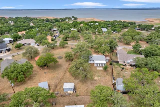 an aerial view of a houses with outdoor space and street view
