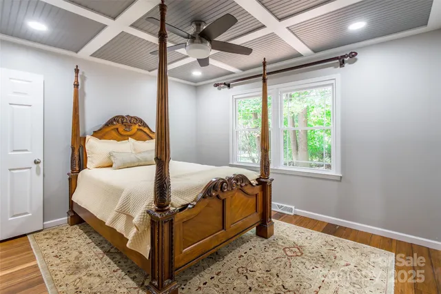 a bed room with a bed and a window