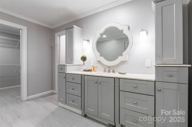 a bathroom with a double vanity sink and mirror