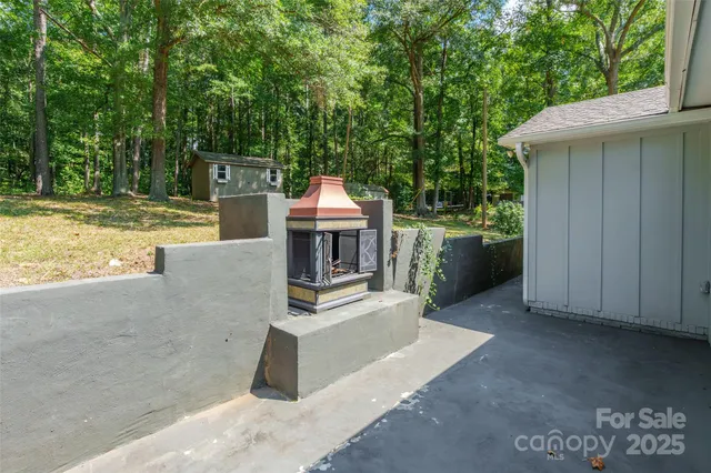 a view of a backyard with sitting area