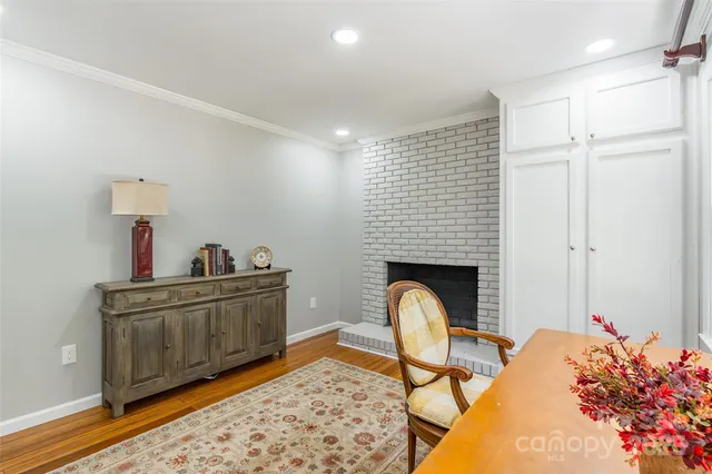 a living room with a sink furniture and a fireplace