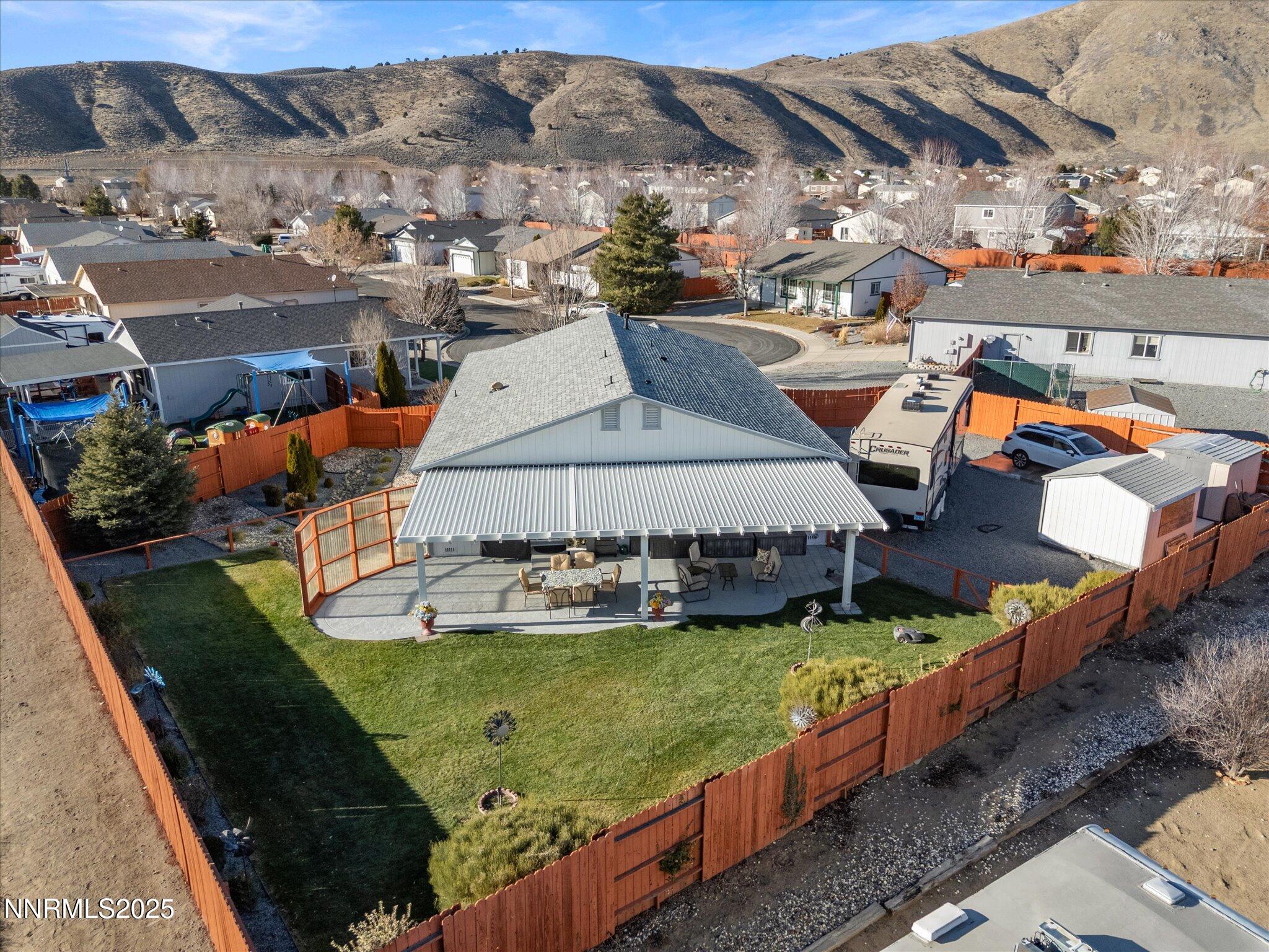17634 Georgetown Court Reno, NV 89508 - Photo 11 of 56 a view of a swimming pool with a garden and mountain view