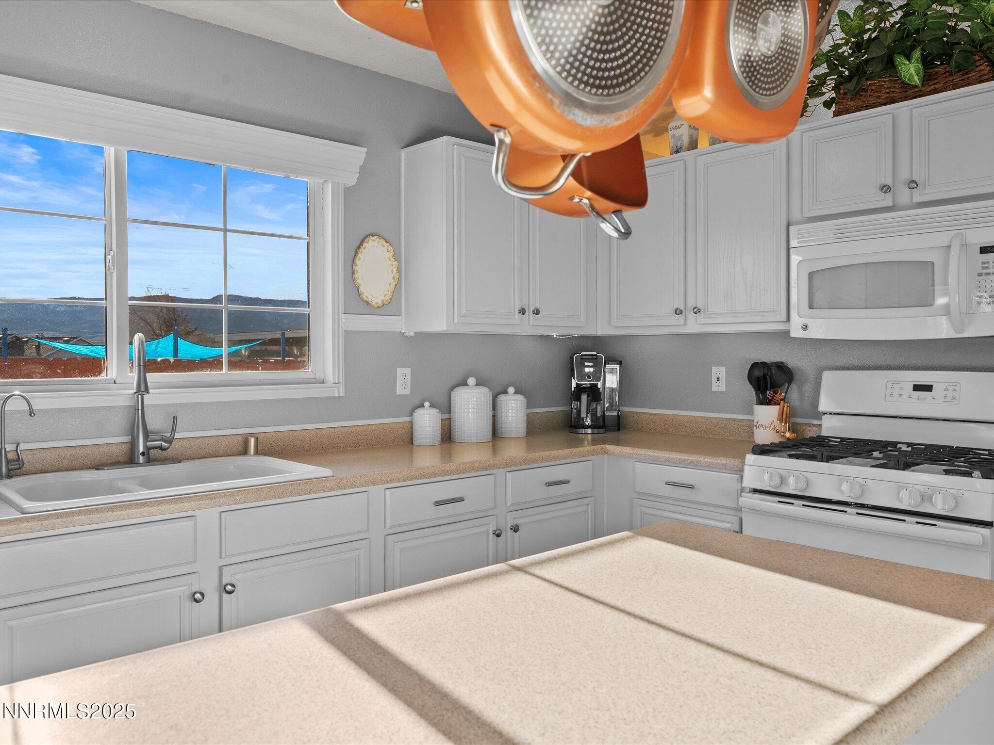 17634 Georgetown Court Reno, NV 89508 - Photo 24 of 56 a kitchen with stainless steel appliances granite countertop a sink and cabinets