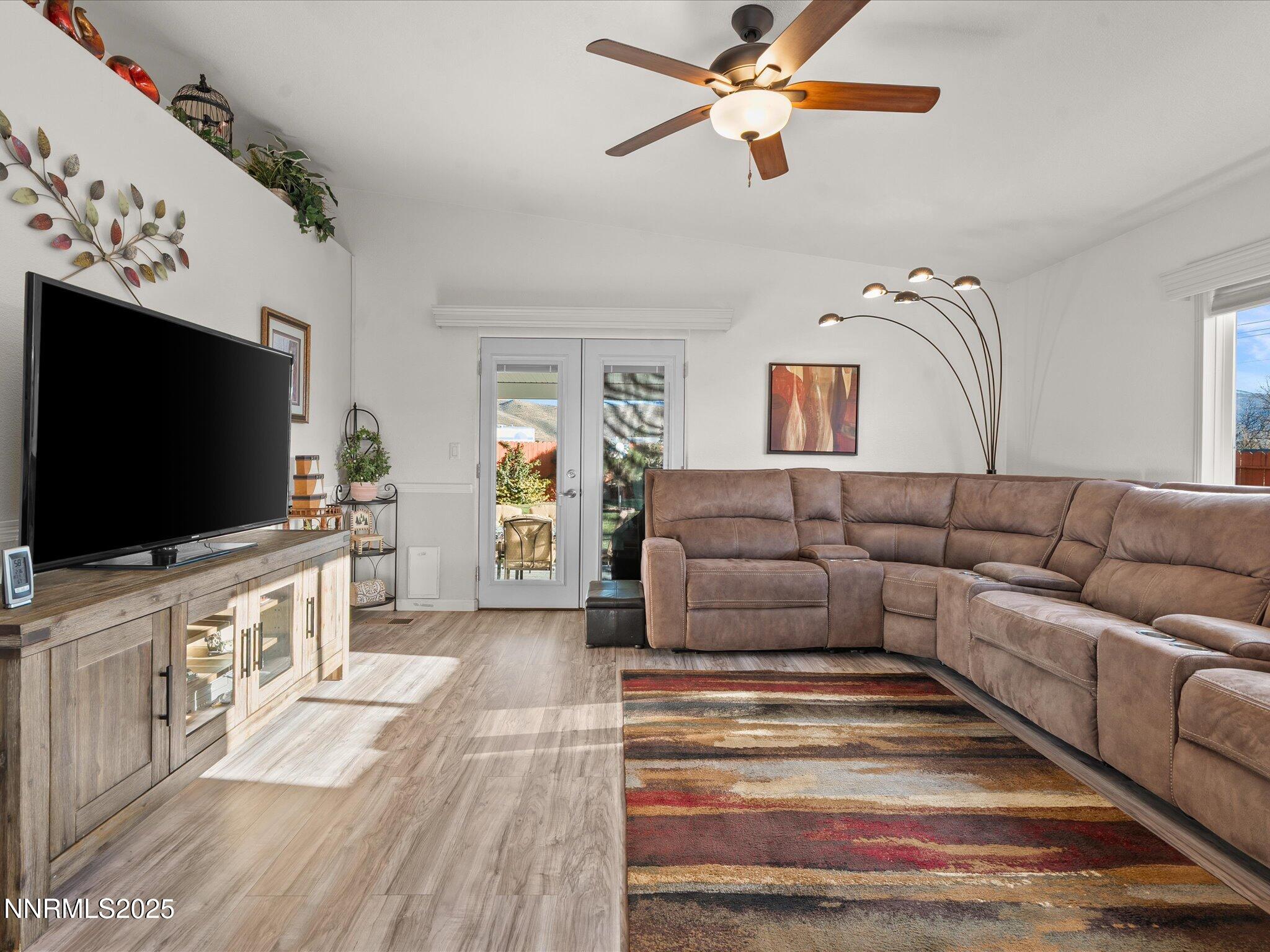 17634 Georgetown Court Reno, NV 89508 - Photo 27 of 56 a living room with furniture and a flat screen tv