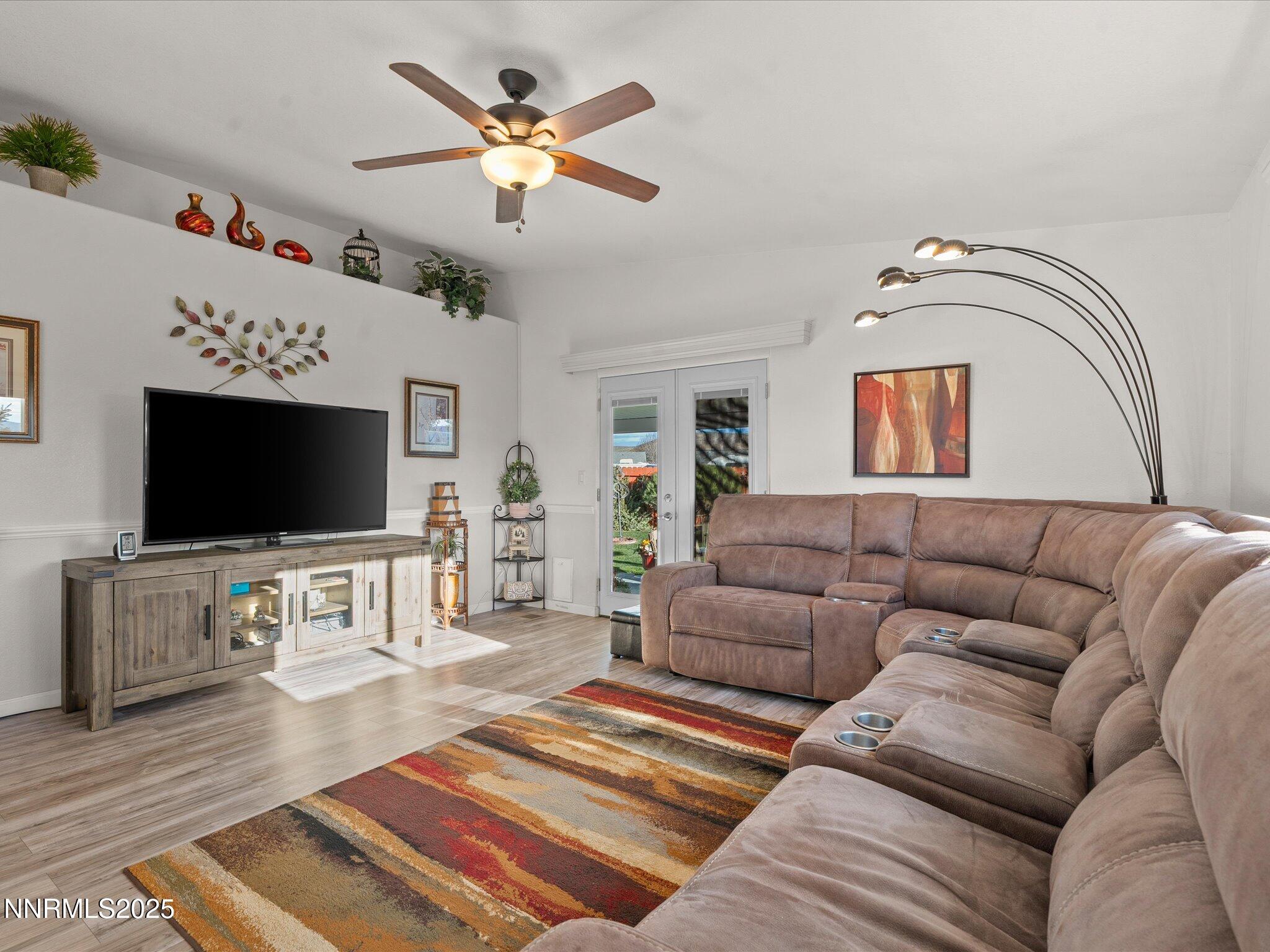 17634 Georgetown Court Reno, NV 89508 - Photo 28 of 56 a living room with furniture and a flat screen tv