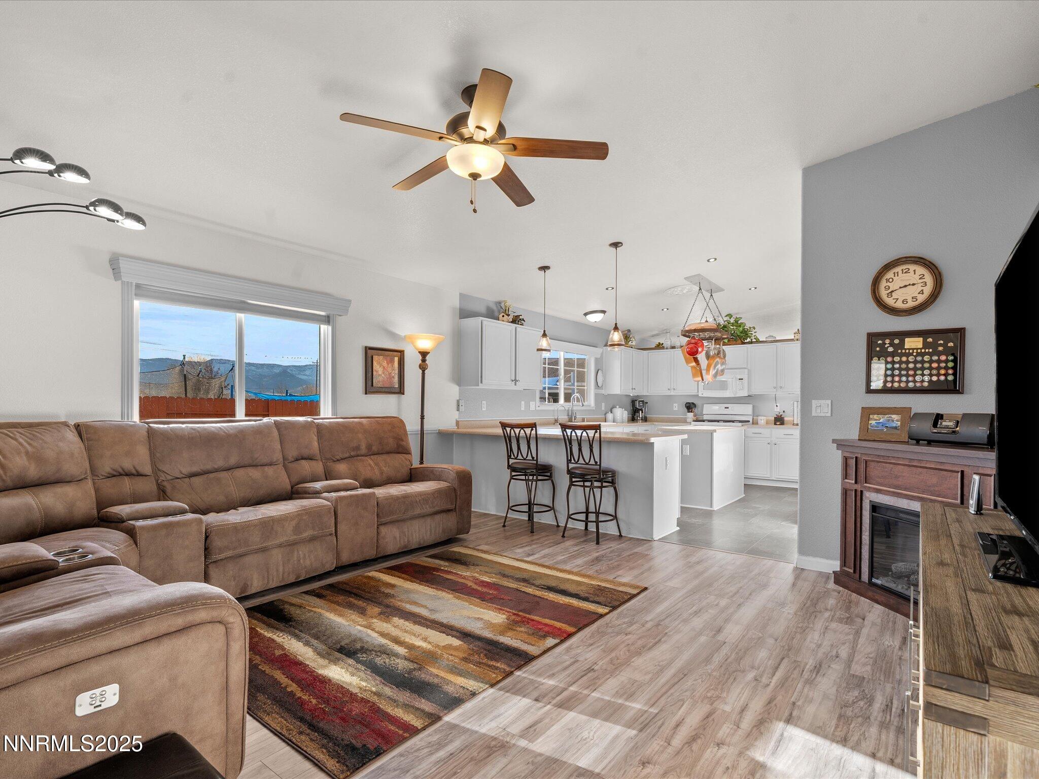 17634 Georgetown Court Reno, NV 89508 - Photo 29 of 56 a living room with furniture and a wooden floor