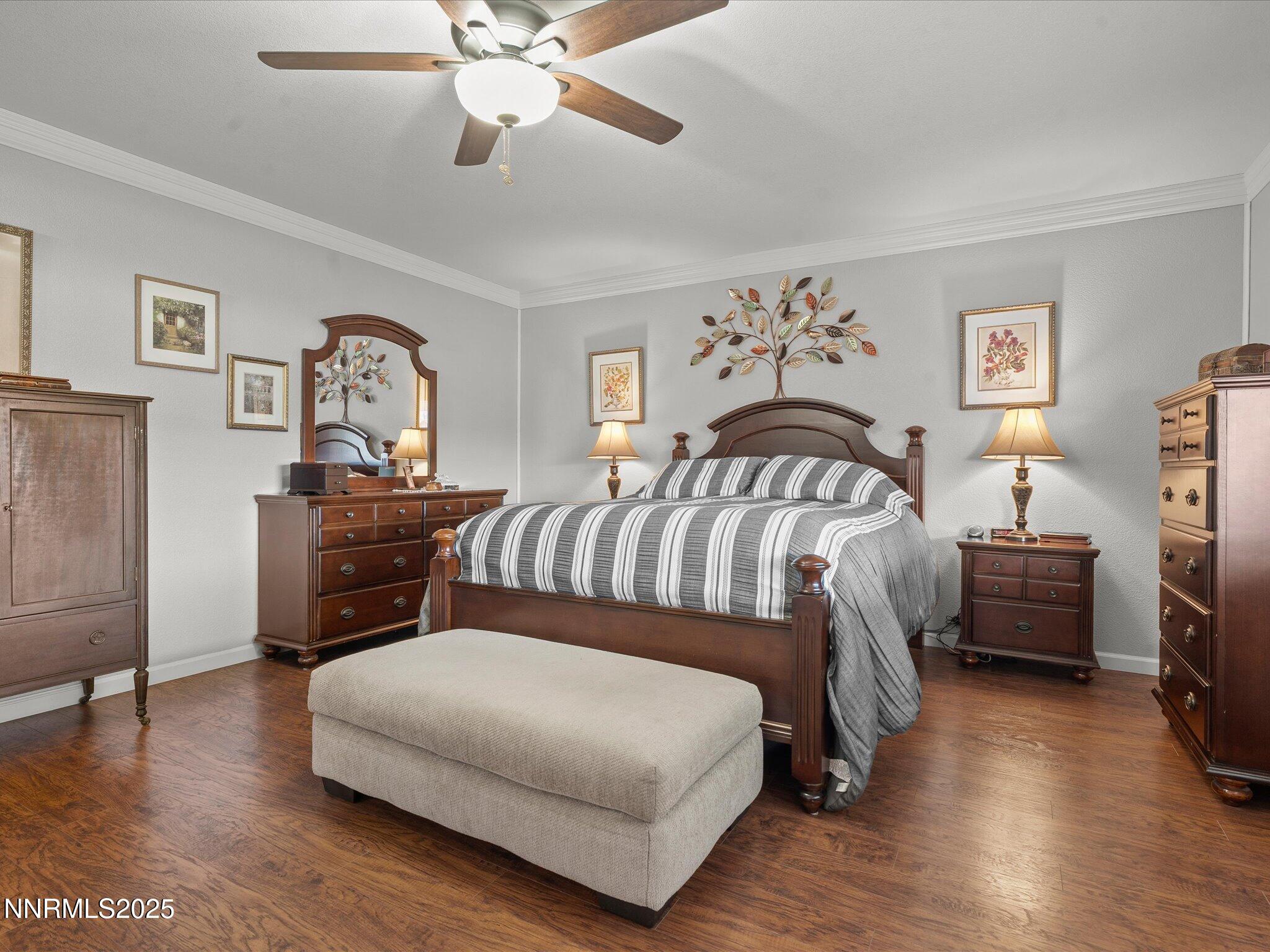 17634 Georgetown Court Reno, NV 89508 - Photo 30 of 56 a bedroom with a bed and a chandelier