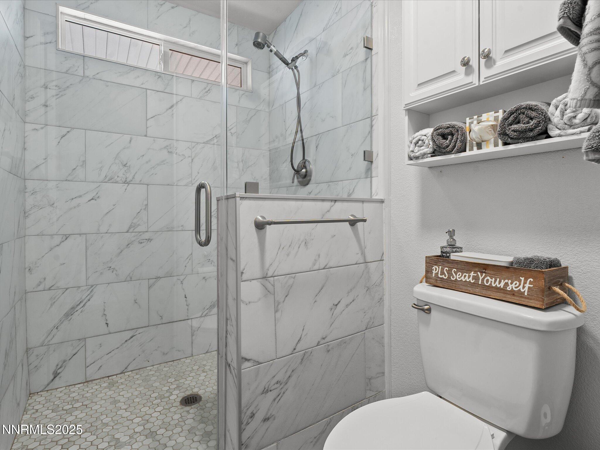 17634 Georgetown Court Reno, NV 89508 - Photo 35 of 56 a bathroom with a toilet and a shower