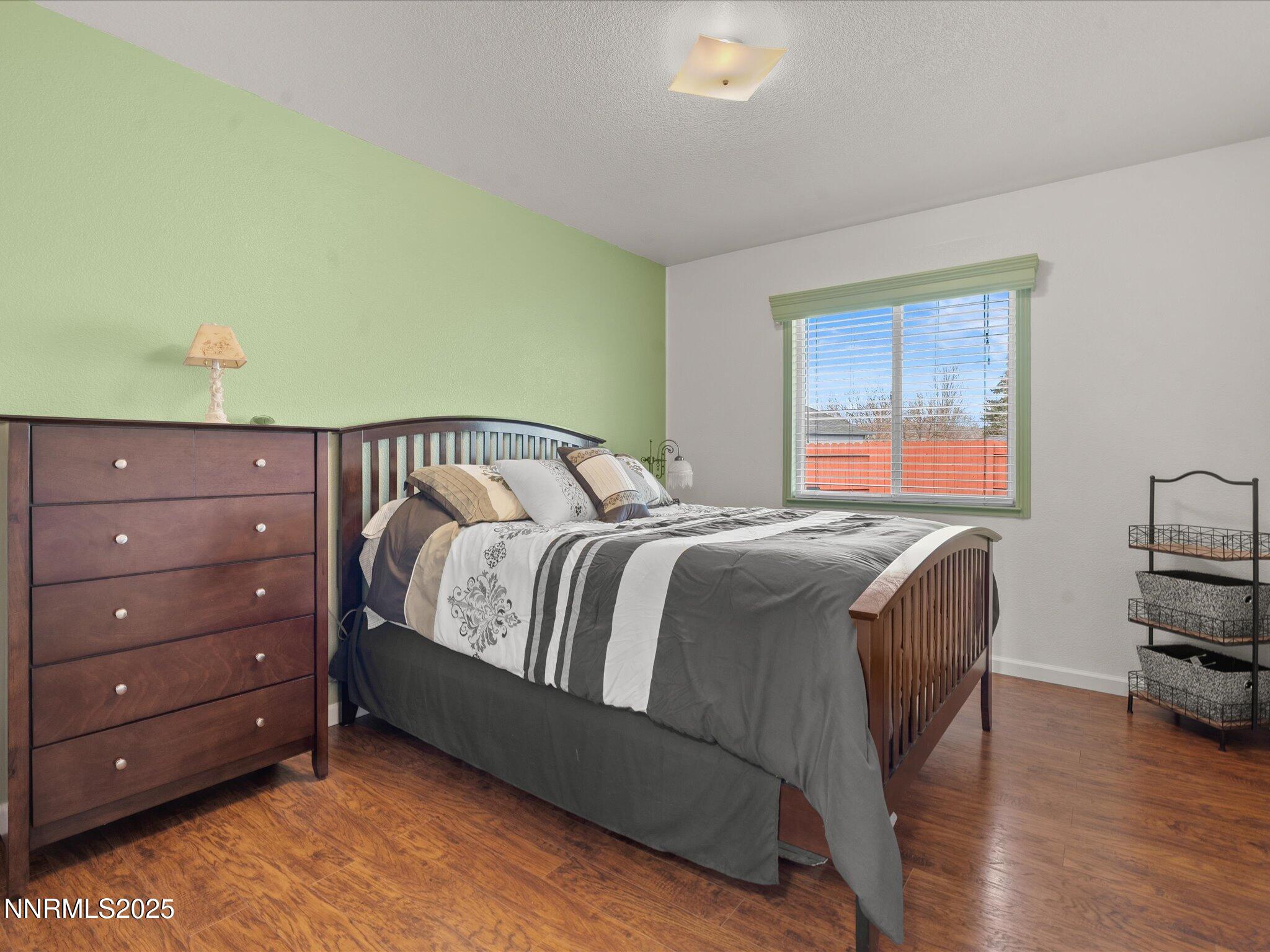 17634 Georgetown Court Reno, NV 89508 - Photo 36 of 56 a bedroom with a bed and a dresser