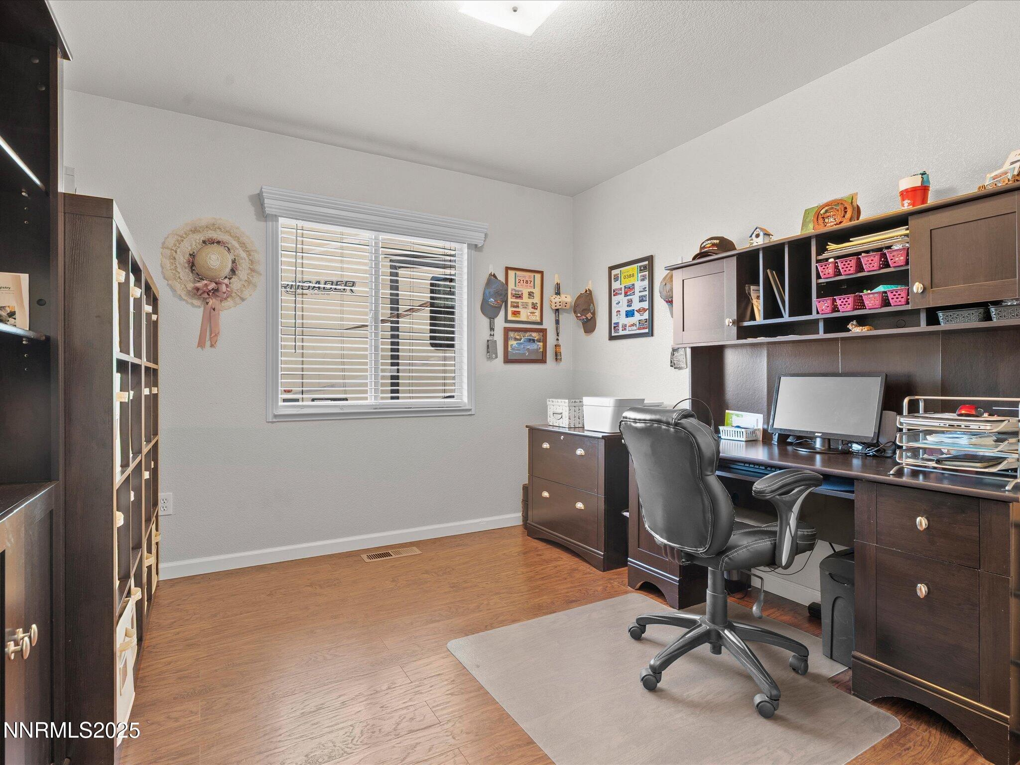 17634 Georgetown Court Reno, NV 89508 - Photo 38 of 56 a view of a workspace with furniture and a window