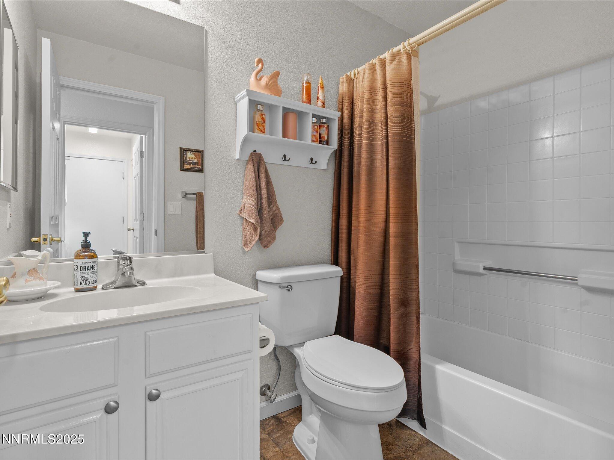 17634 Georgetown Court Reno, NV 89508 - Photo 39 of 56 a bathroom with a sink toilet and shower