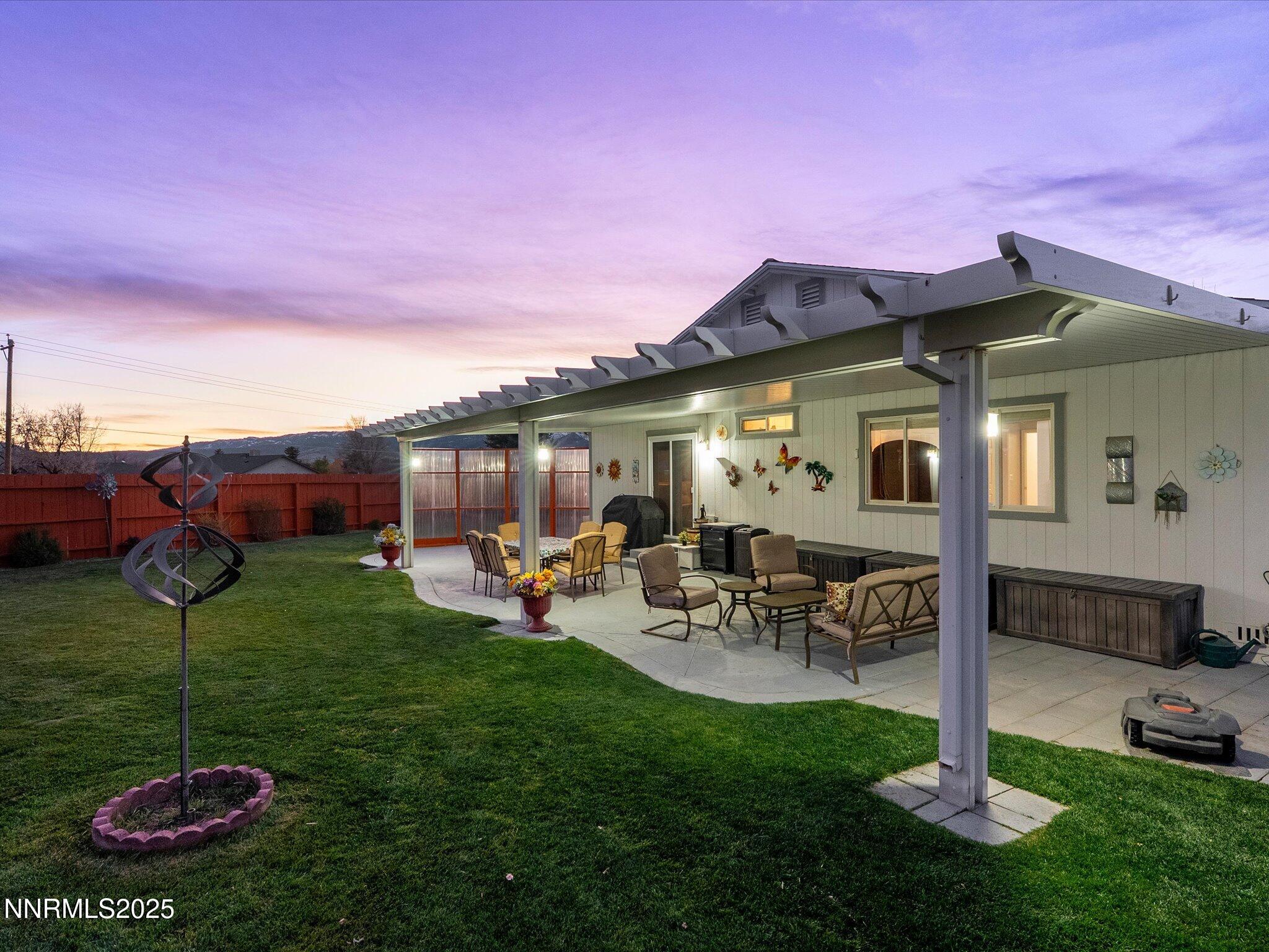 17634 Georgetown Court Reno, NV 89508 - Photo 4 of 56 a view of a house with backyard sitting area and garden