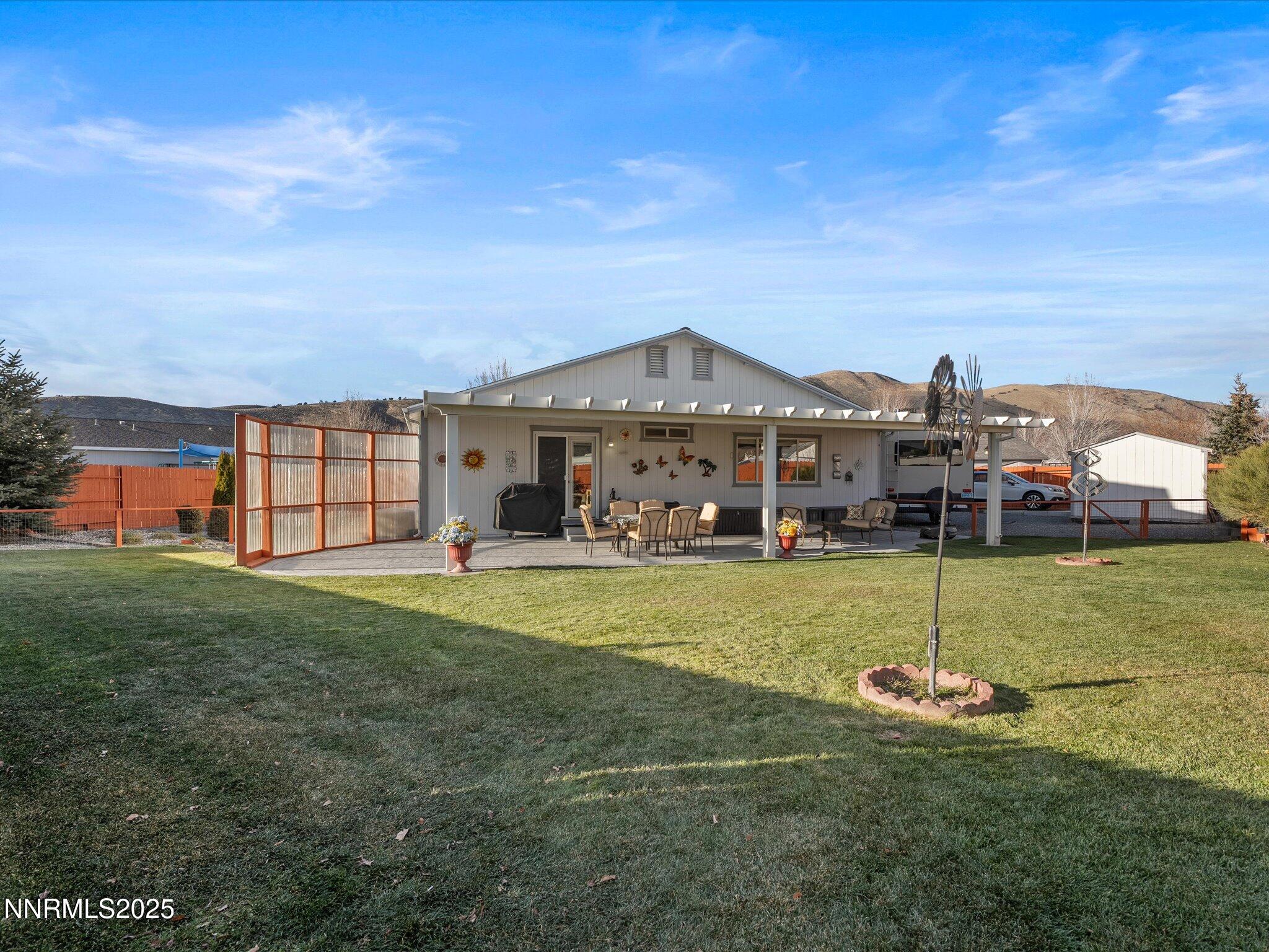 17634 Georgetown Court Reno, NV 89508 - Photo 41 of 56 a view of a big house with a big yard and potted plants