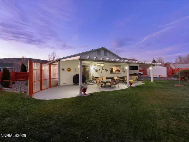 a front view of a house with a garden and porch