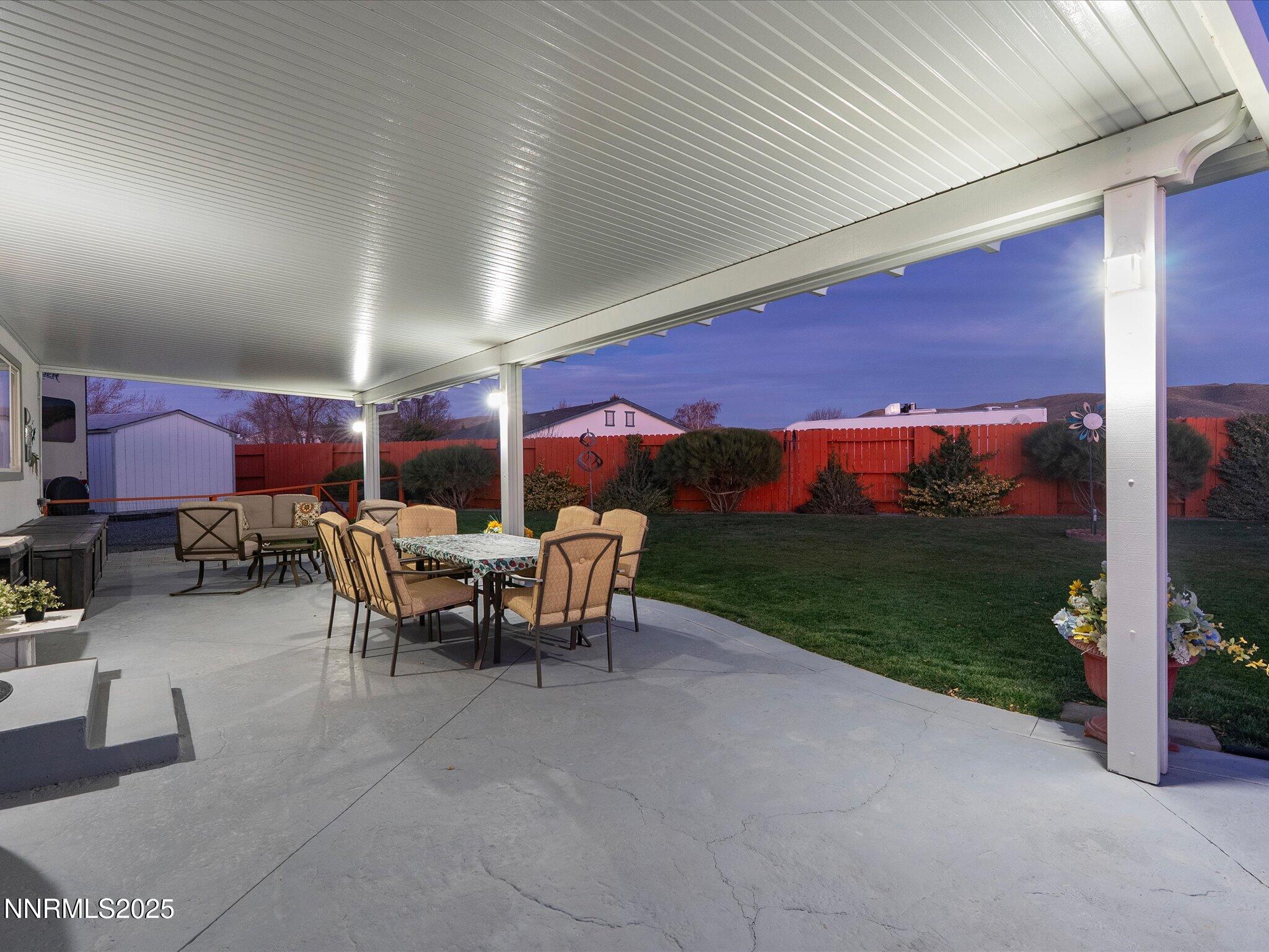 17634 Georgetown Court Reno, NV 89508 - Photo 9 of 56 a view of a patio with a dining table and chairs