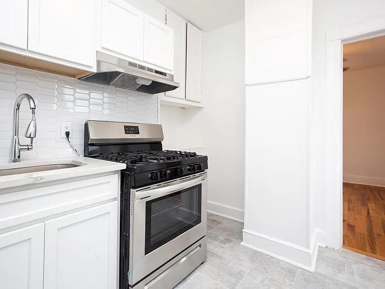 733 Hudson Avenue, Unit 2 Secaucus, NJ 07094 - Photo 4 of 13 a kitchen with stainless steel appliances granite countertop a stove and a sink