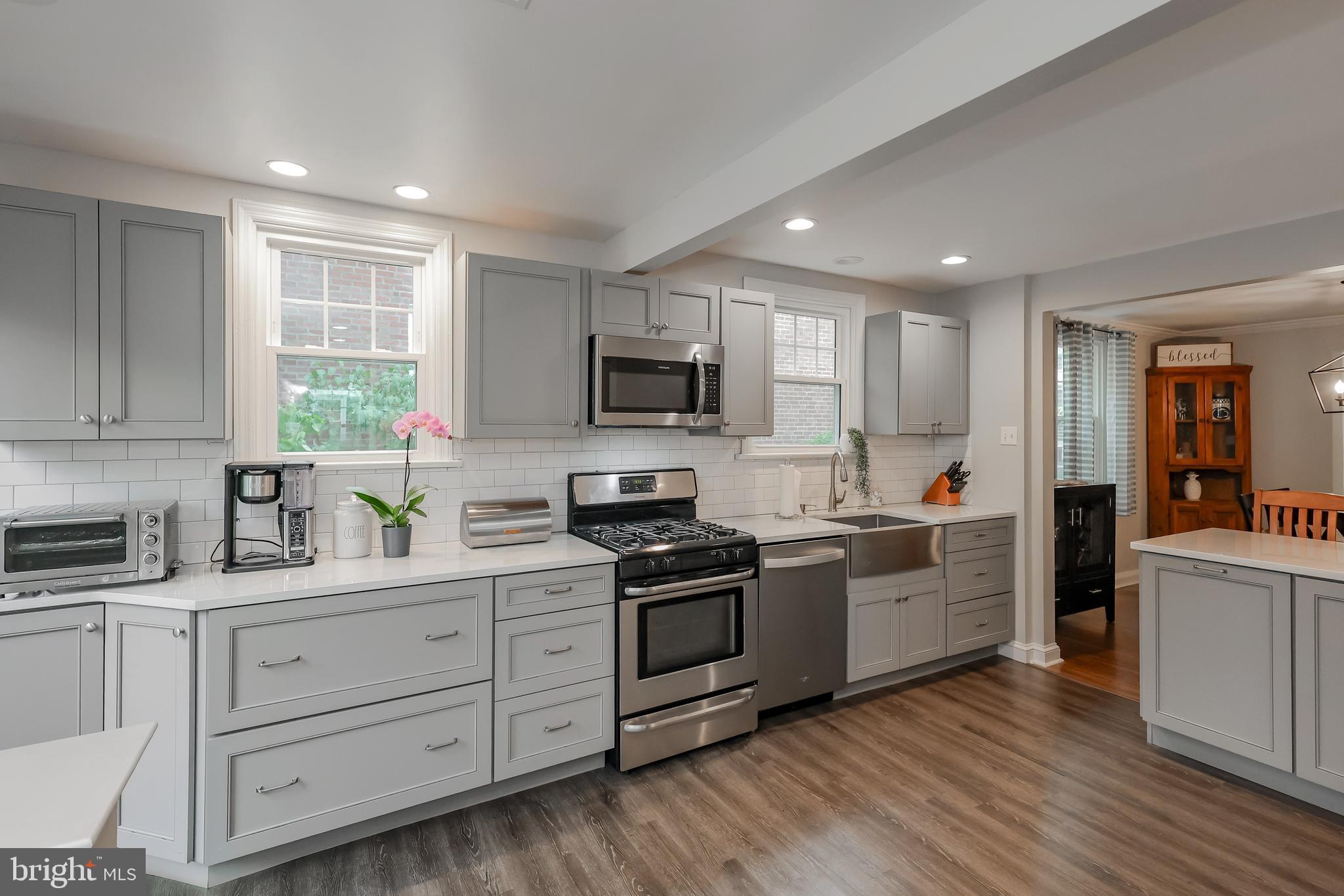 2710 Prescott Road Havertown, PA 19083 - Photo 11 of 38 a kitchen with granite countertop white cabinets and stainless steel appliances