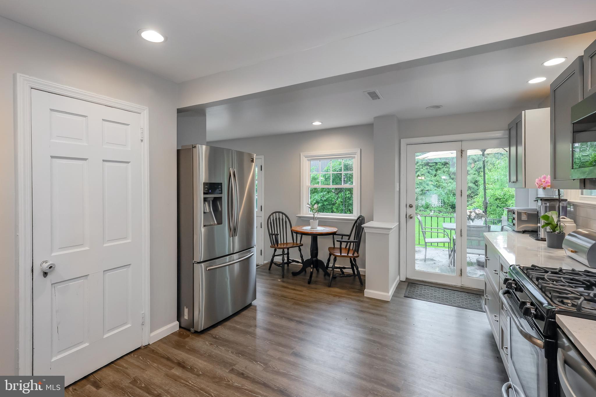 2710 Prescott Road Havertown, PA 19083 - Photo 14 of 38 a kitchen with stainless steel appliances granite countertop a refrigerator stove and wooden floor