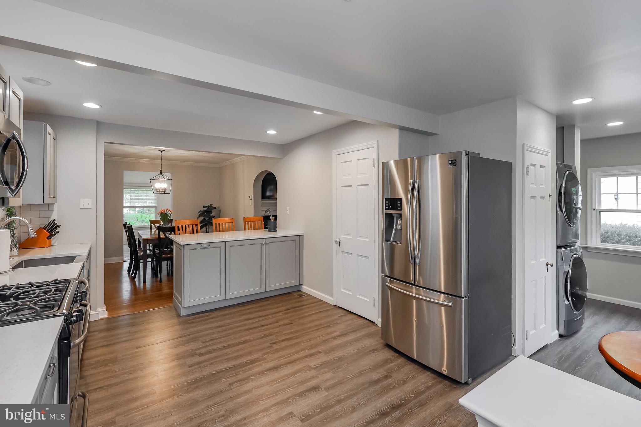 2710 Prescott Road Havertown, PA 19083 - Photo 15 of 38 a kitchen with stainless steel appliances wooden floor and a refrigerator