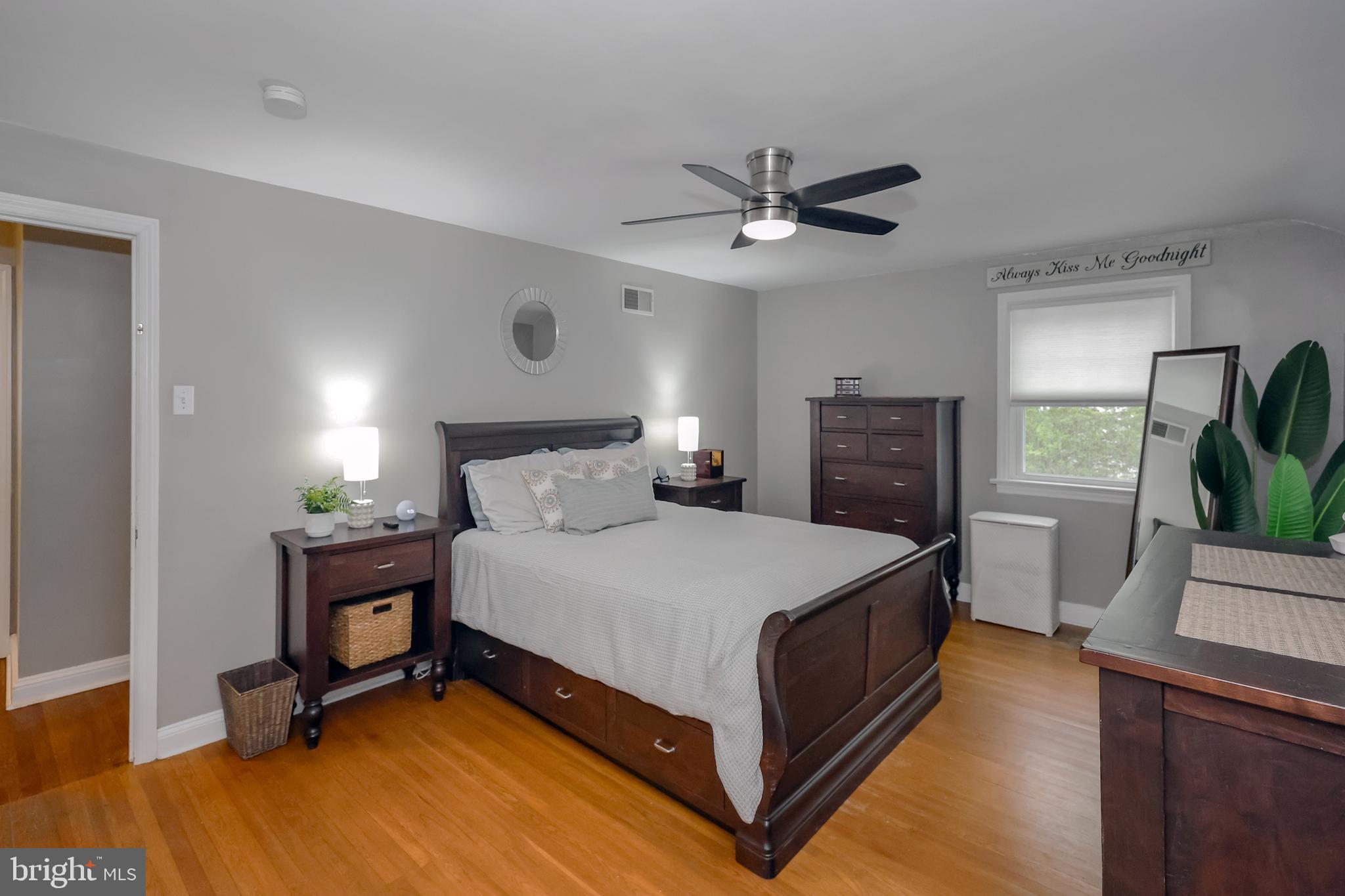 2710 Prescott Road Havertown, PA 19083 - Photo 21 of 38 a bedroom with a bed and a potted plant on the dresser