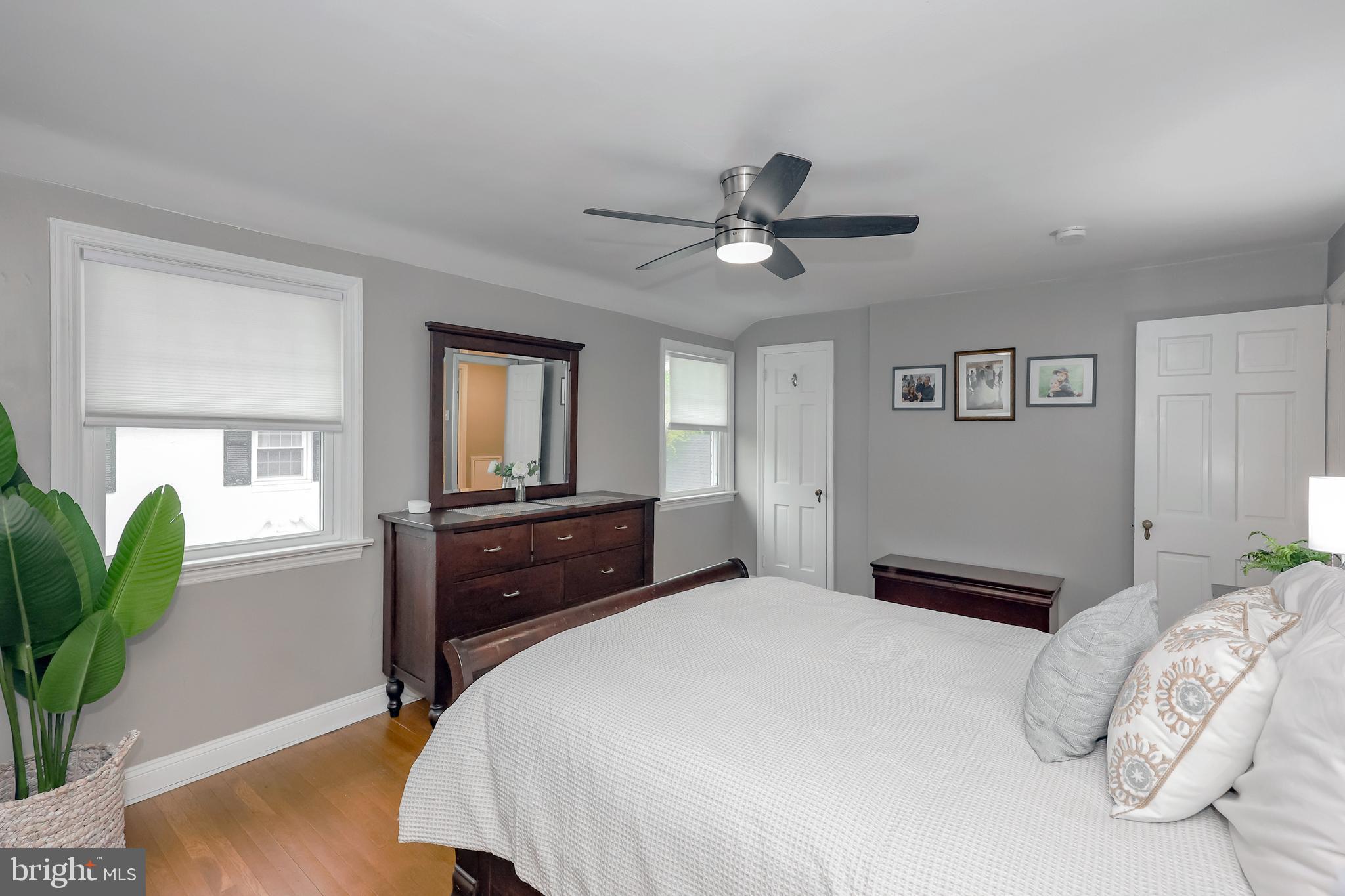 2710 Prescott Road Havertown, PA 19083 - Photo 23 of 38 a bedroom with a bed and a potted plant
