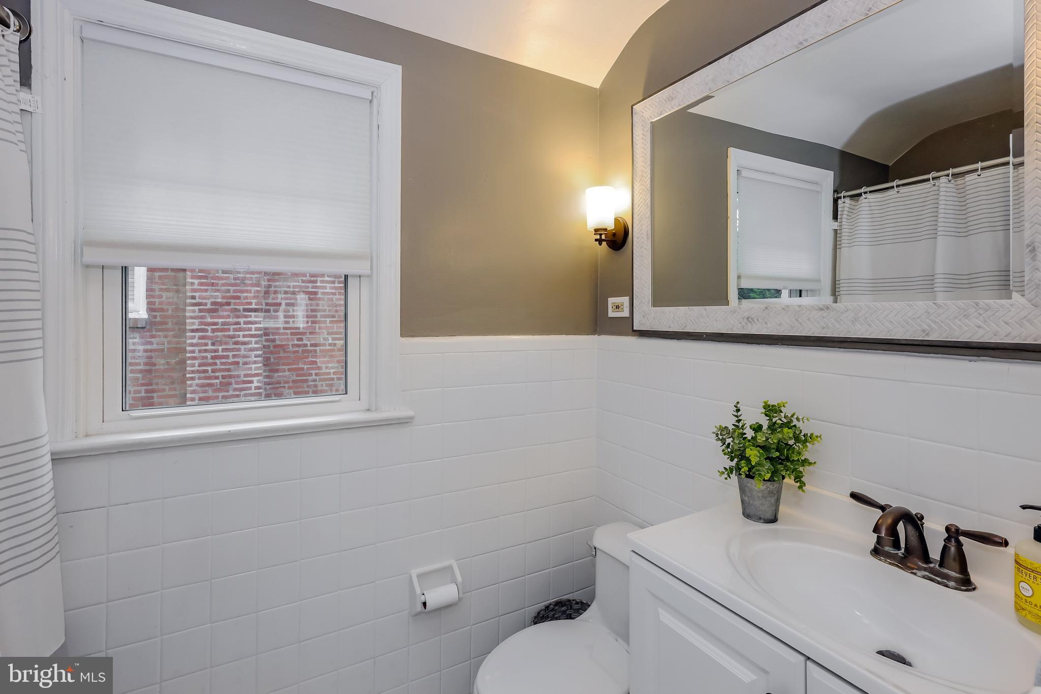 2710 Prescott Road Havertown, PA 19083 - Photo 28 of 38 a bathroom with a sink a toilet and a mirror