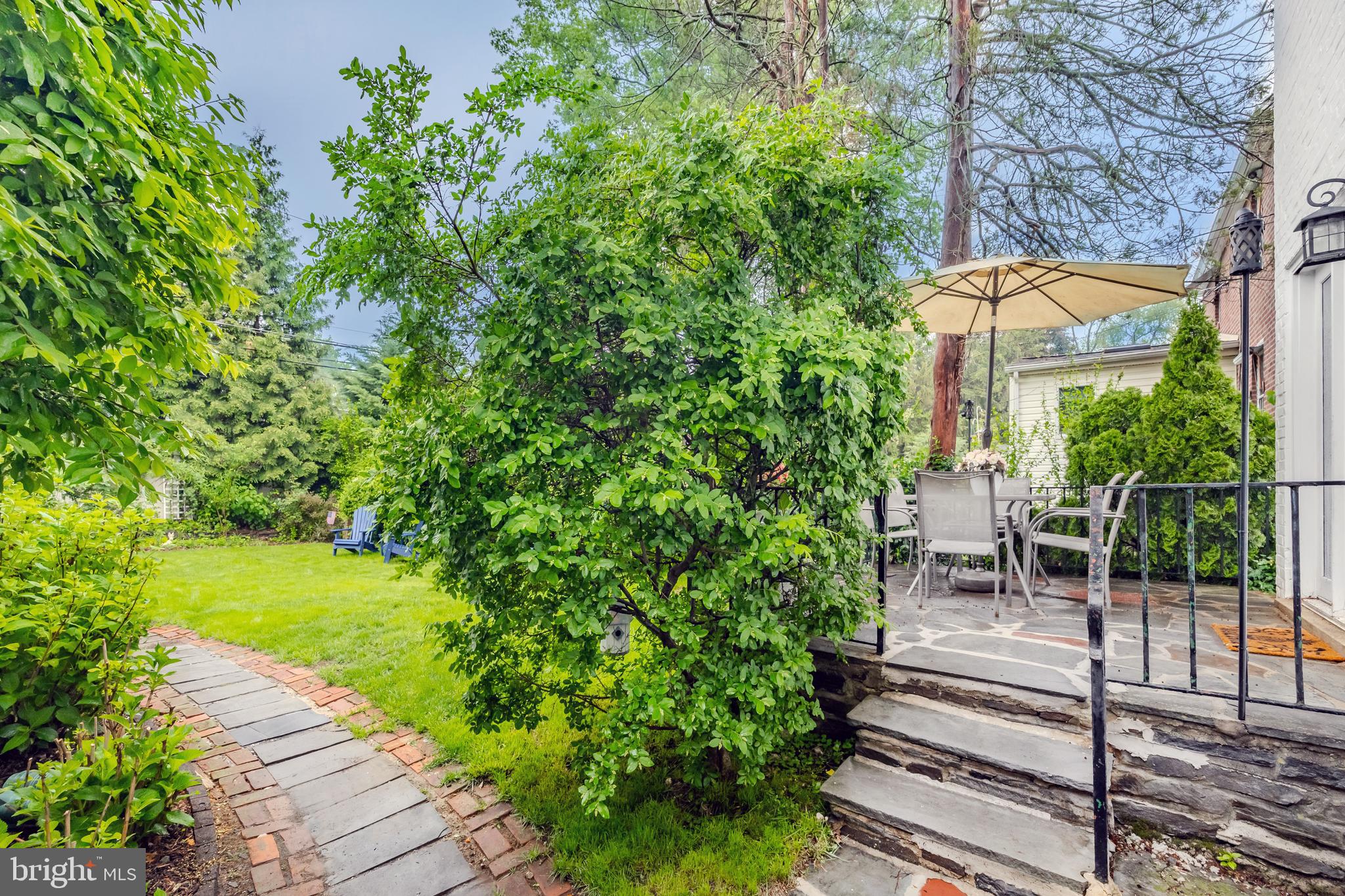 2710 Prescott Road Havertown, PA 19083 - Photo 36 of 38 a view of a patio with table and chairs potted plants with wooden floor and fence