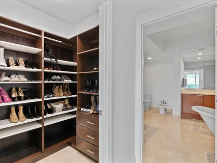 a view of walk in closet and bedroom view