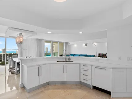 a kitchen with white cabinets