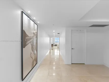 a view of hallway with wooden floor